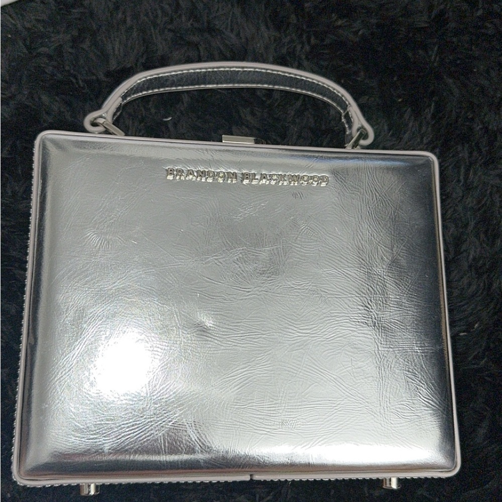 Brandon Blackwood Metallic trunk
